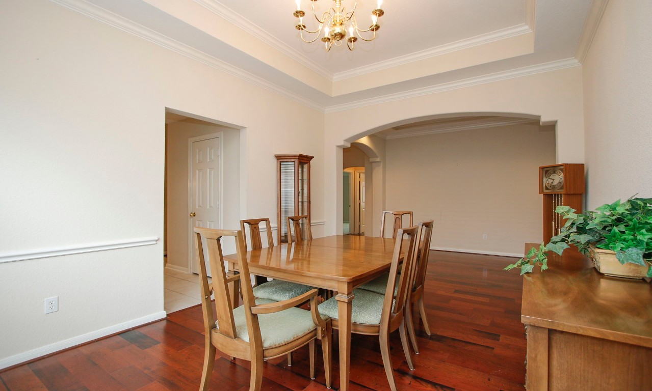 1114 Bringewood Chase Drive Spring, TX 77379 - Photo 10 of 49 Chair and crown molding. Wood floors.