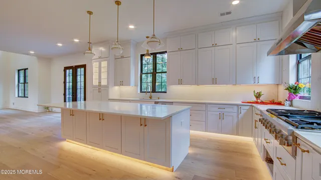 a view of a green field with lots of trees