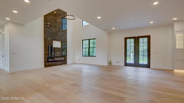 a kitchen with kitchen island granite countertop a sink a counter top space stainless steel appliances and cabinets