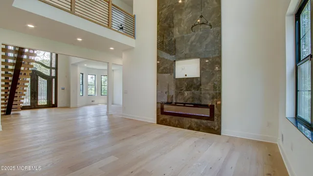 a kitchen with kitchen island stainless steel appliances a sink stove and refrigerator