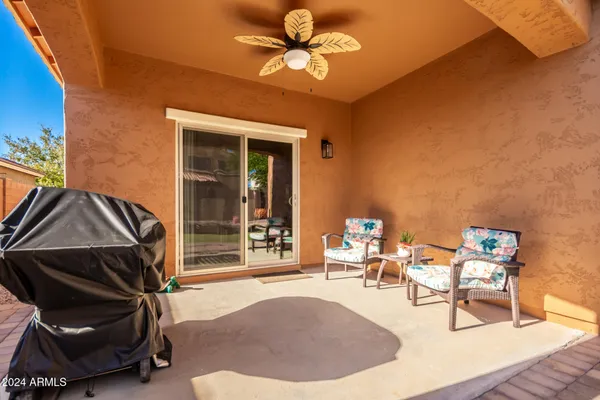 a view of a livingroom with furniture and a ceiling fan