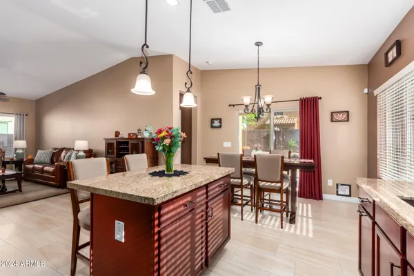 a kitchen island with granite countertop dining room