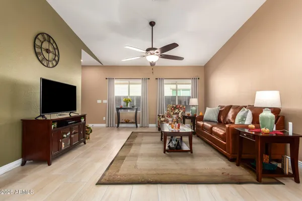 a living room with furniture and a flat screen tv