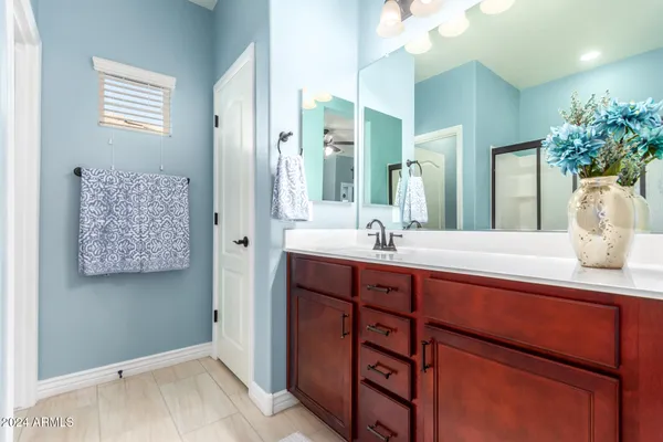 a bathroom with a double vanity sink and a mirror