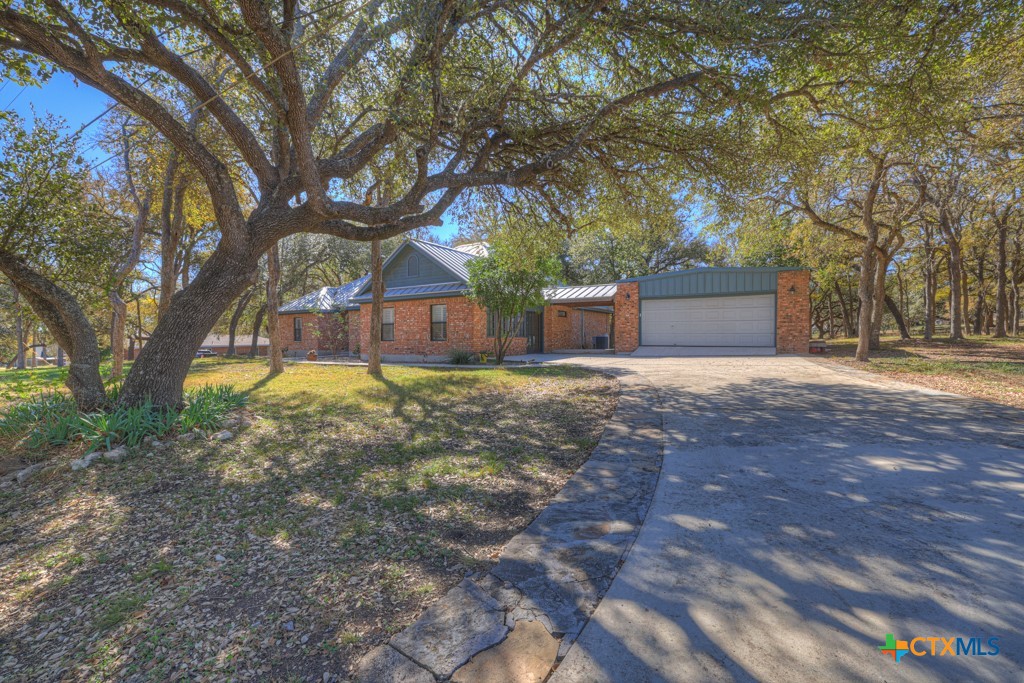 1909 Maple Street San Marcos, TX 78666 - Photo 1 of 1 a view of a house with a yard