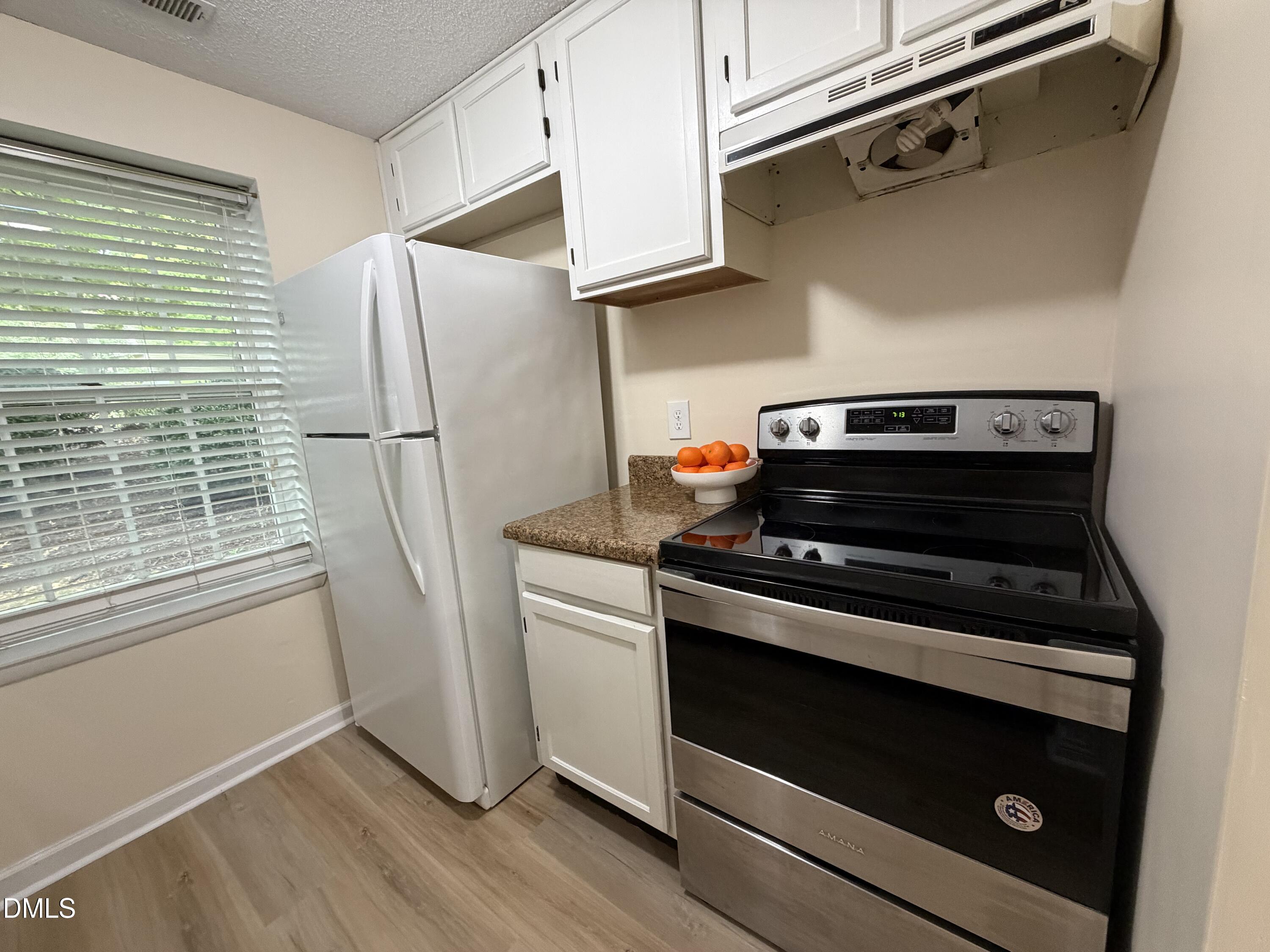 7766 Sandra Lane Raleigh, NC 27615 - Photo 3 of 29 Kitchen oven side