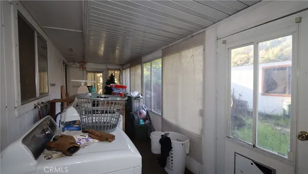 a room with furniture and a window