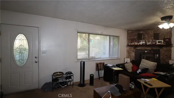 a very nice looking room with many windows and furniture