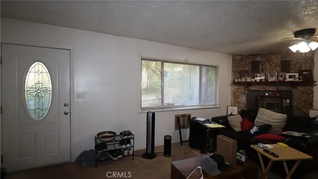 a very nice looking room with many windows and furniture