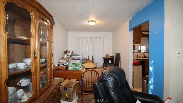 a view of a livingroom with furniture and storage