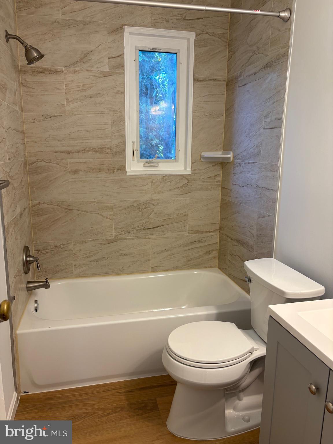 3222 13th Road South Arlington, VA 22204 - Photo 11 of 18 a bathroom with toilet bathtub and shower
