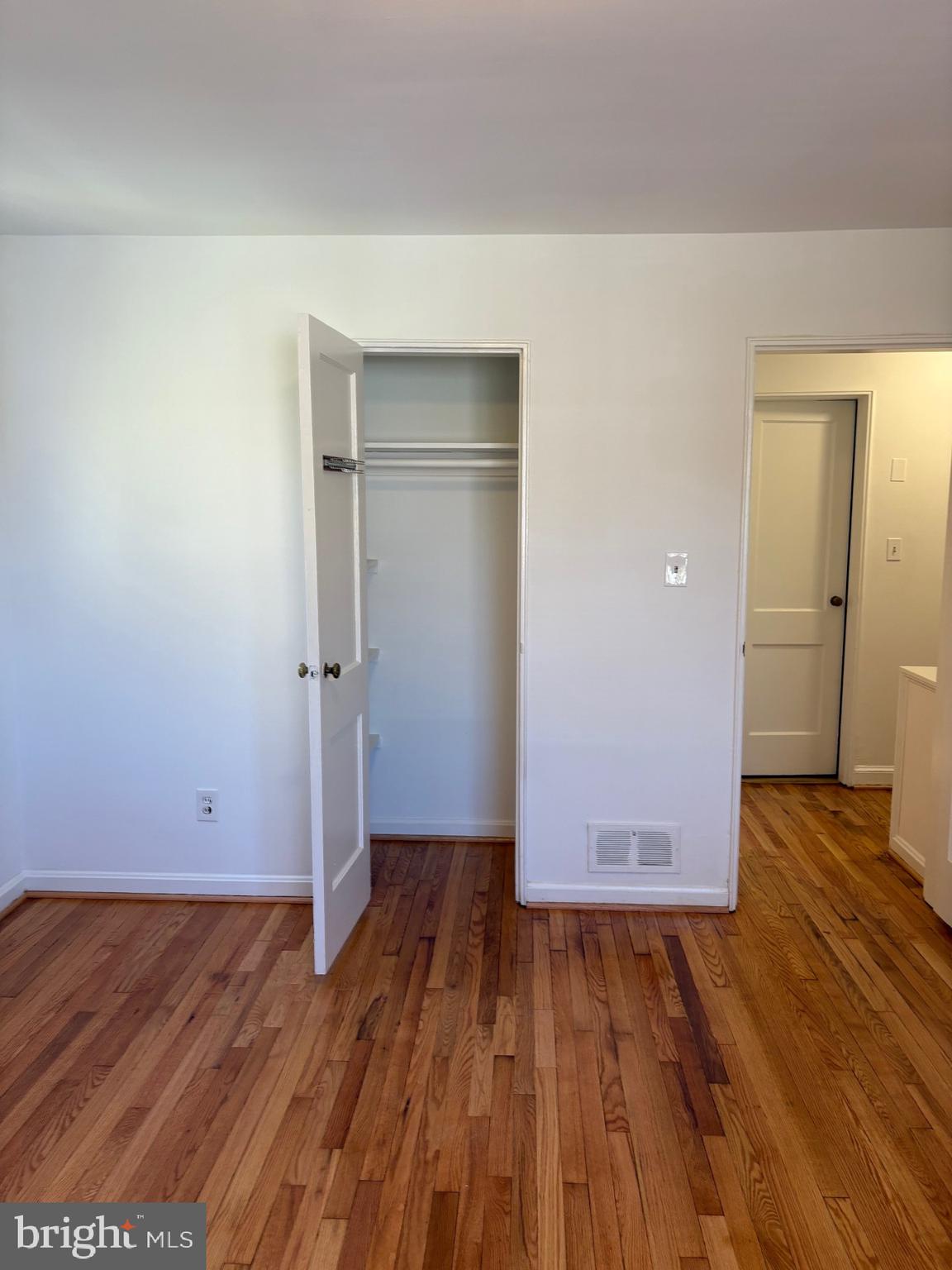 3222 13th Road South Arlington, VA 22204 - Photo 14 of 18 an empty room with wooden floor and closet