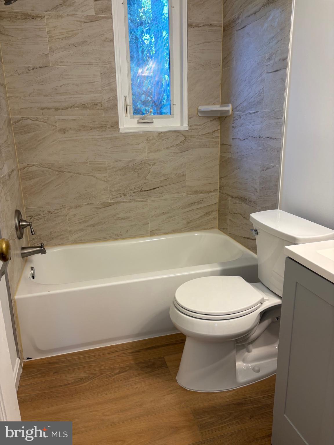 3222 13th Road South Arlington, VA 22204 - Photo 10 of 18 a bathroom with a toilet and a bath tub