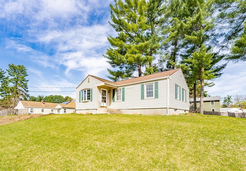 16 Middlebrook Drive Springfield, MA 01129 - Photo 3 of 30 a front view of house with yard and trees around