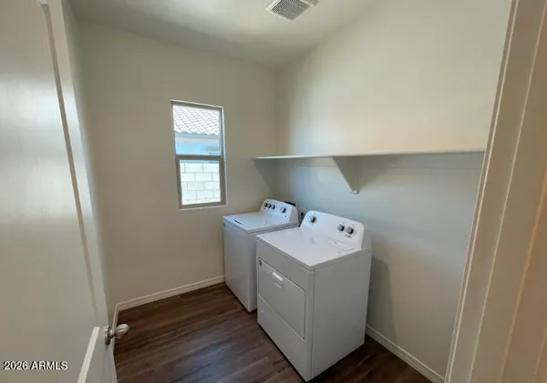 a utility room with washer and dryer