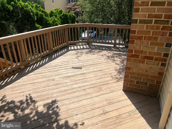 a view of balcony with wooden floor