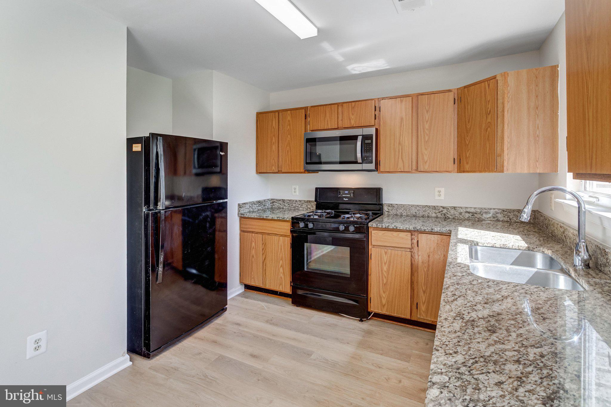 6489 McCoy Road Centreville, VA 20121 - Photo 11 of 34 Modern kitchen with sleek finishes.