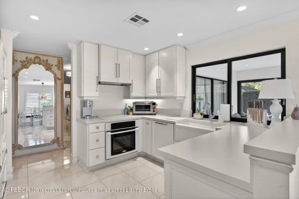 a kitchen with a sink stove and refrigerator