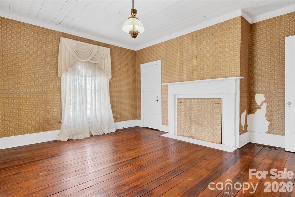 11124 Eastfield Road Huntersville, NC 28078 - Photo 27 of 41 an empty room with wooden floor and a window