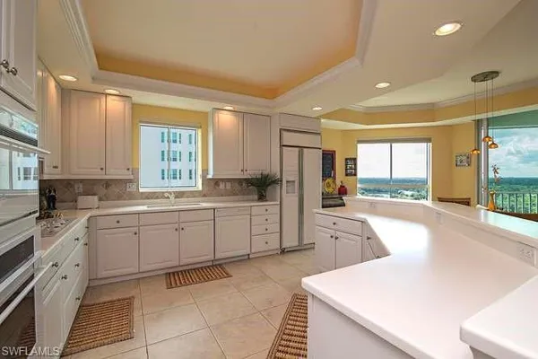 a large kitchen with a large window