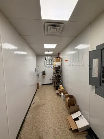 a room with gym equipment and a mirror