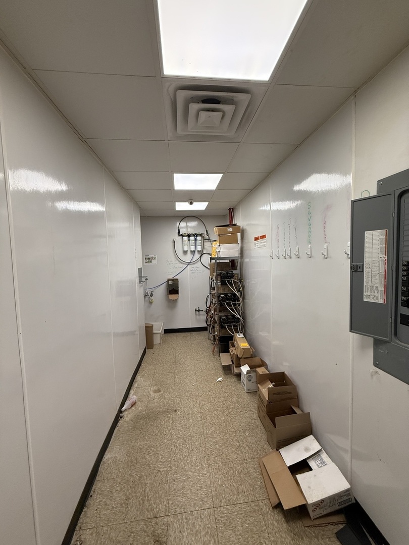 330 North 1st Street Cuba, IL 61427 - Photo 8 of 10 a room with gym equipment and a mirror