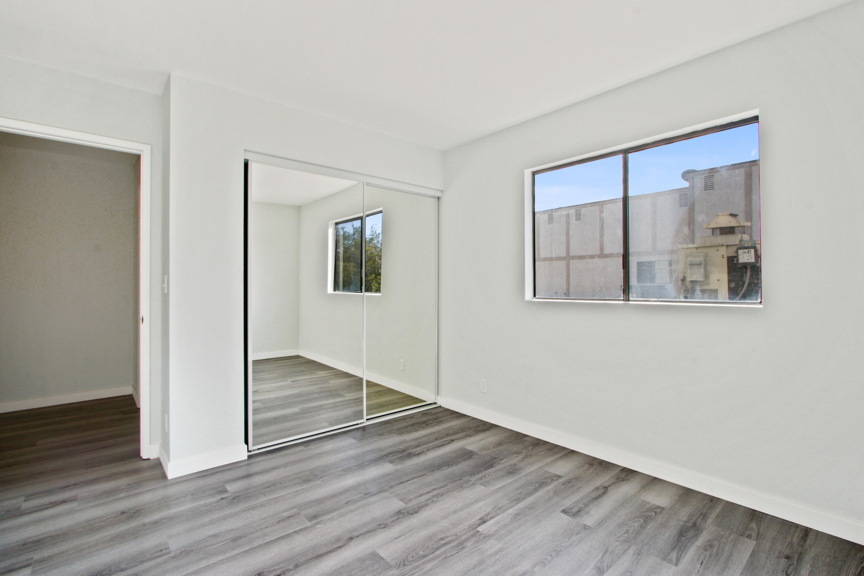 9542 Ball Road, Unit 1 Anaheim, CA 92804 - Photo 12 of 24 a view of empty room with wooden floor and fan