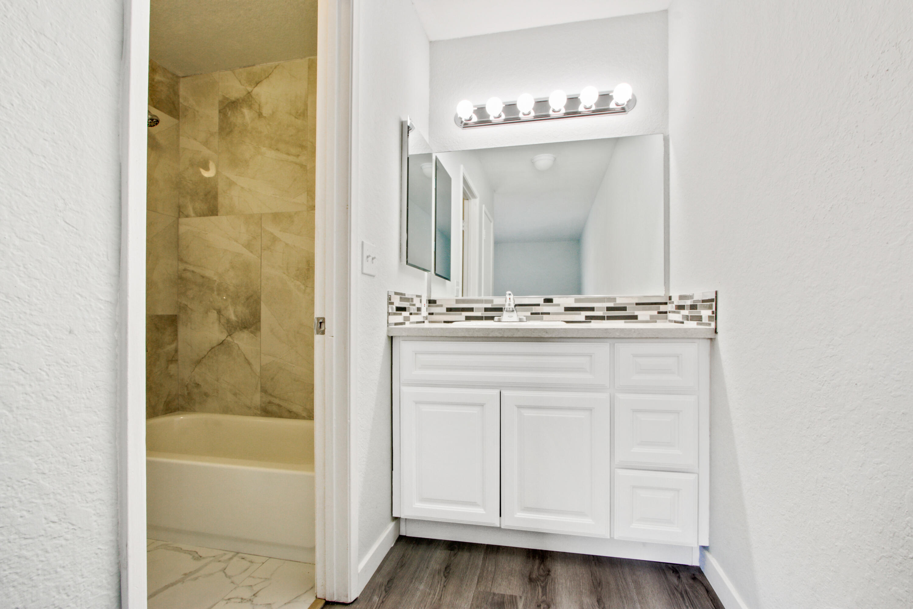 9542 Ball Road, Unit 1 Anaheim, CA 92804 - Photo 13 of 24 a bathroom with a mirror