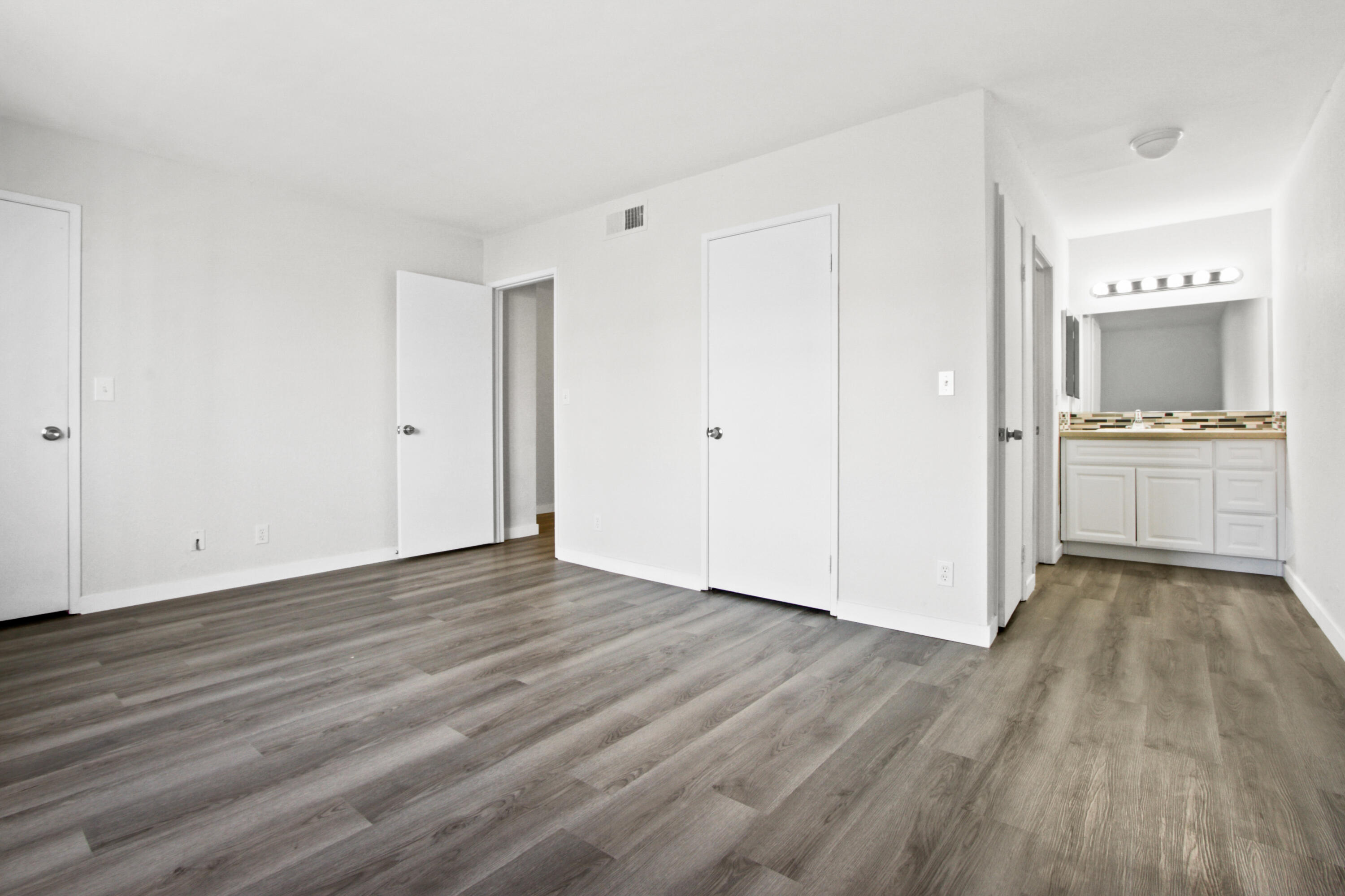 9542 Ball Road, Unit 1 Anaheim, CA 92804 - Photo 16 of 24 a view of a kitchen with wooden floor and a sink