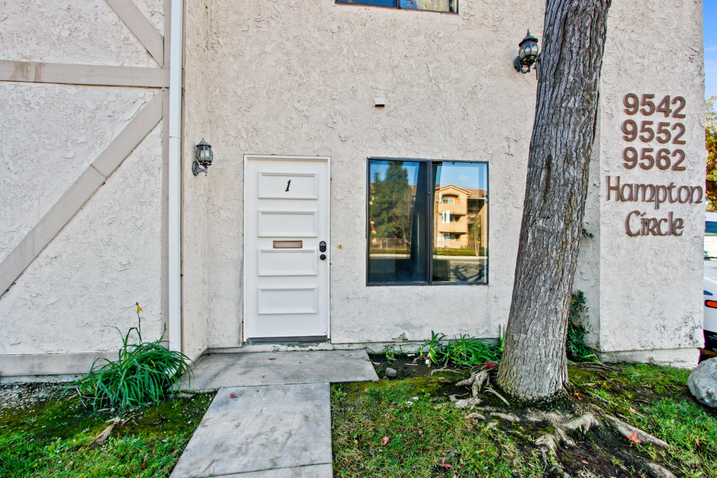 9542 Ball Road, Unit 1 Anaheim, CA 92804 - Photo 24 of 24 a front view of a house with a yard