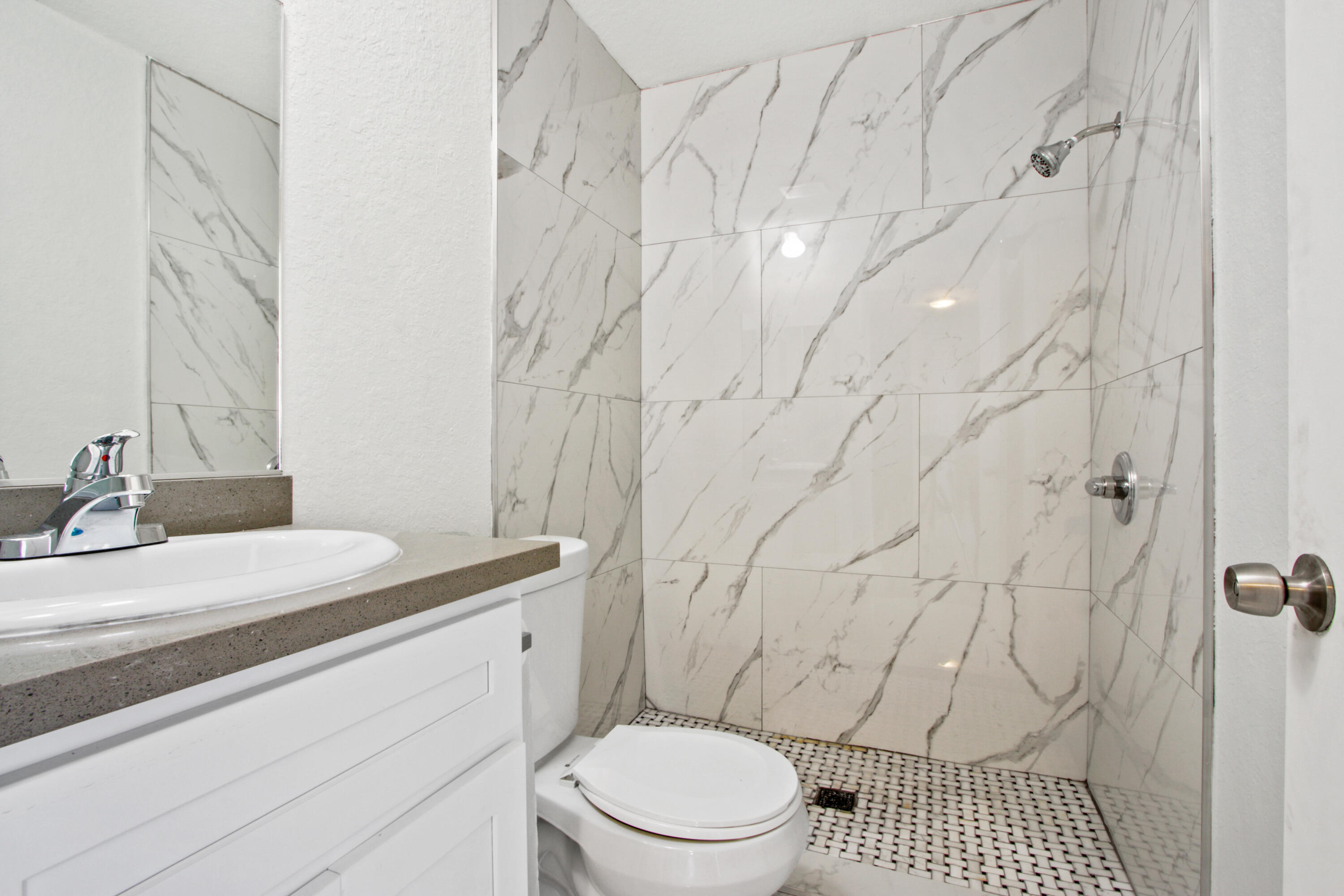 9542 Ball Road, Unit 1 Anaheim, CA 92804 - Photo 10 of 24 a bathroom with a granite countertop sink toilet and shower