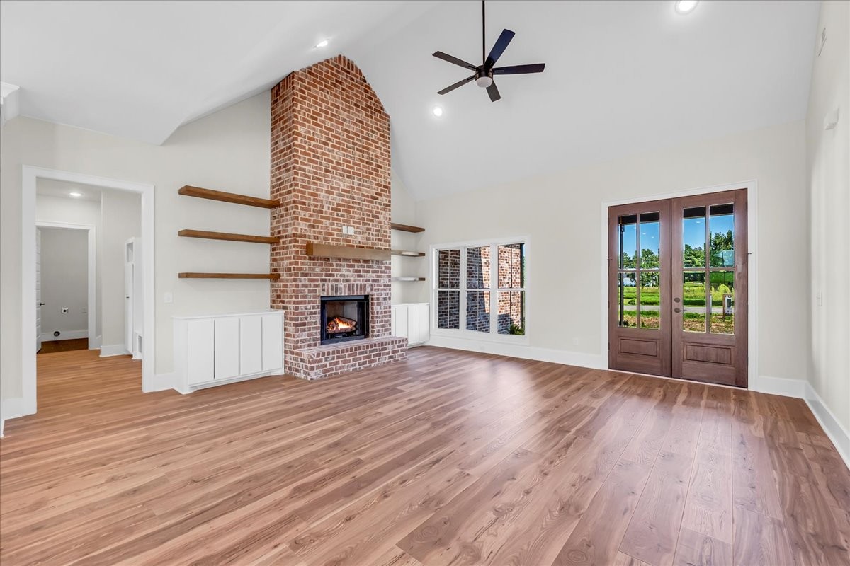309 Hickory Grove Drive Morrison, TN 37357 - Photo 13 of 50 a view of empty room with wooden floor and fireplace