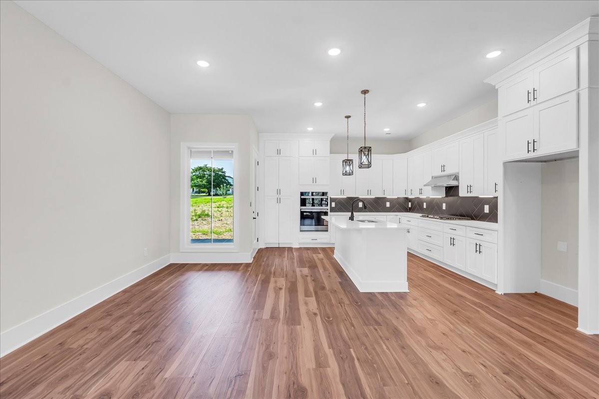 309 Hickory Grove Drive Morrison, TN 37357 - Photo 15 of 50 a kitchen with a white wooden floors and white stainless steel appliances