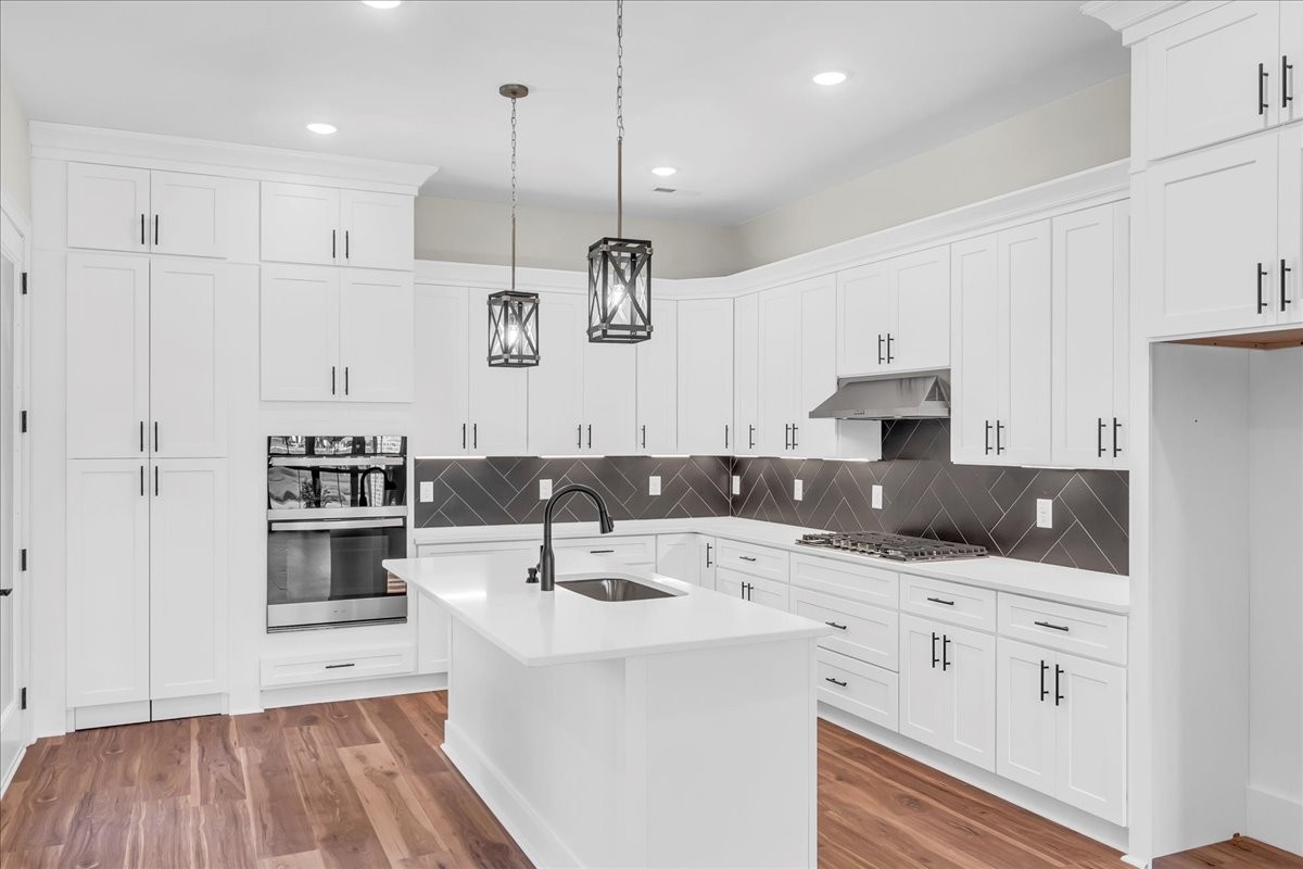 309 Hickory Grove Drive Morrison, TN 37357 - Photo 18 of 50 a kitchen with kitchen island a white counter top space cabinets and stainless steel appliances