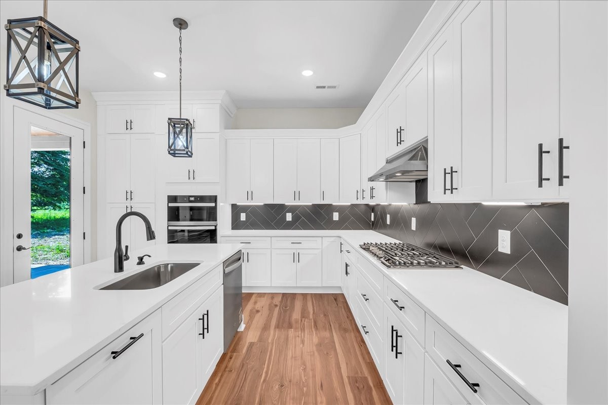 309 Hickory Grove Drive Morrison, TN 37357 - Photo 25 of 50 a kitchen with stainless steel appliances granite countertop a sink and cabinets