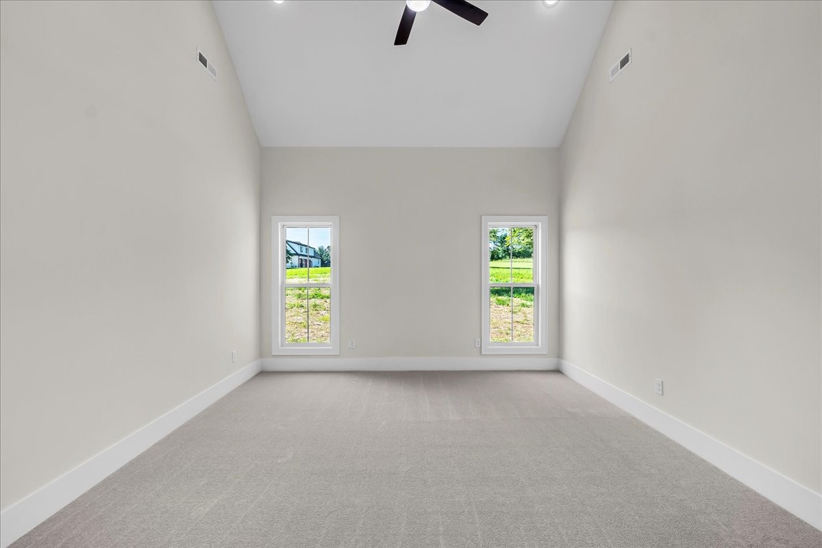 309 Hickory Grove Drive Morrison, TN 37357 - Photo 26 of 50 a view of an empty room with window and kitchen area