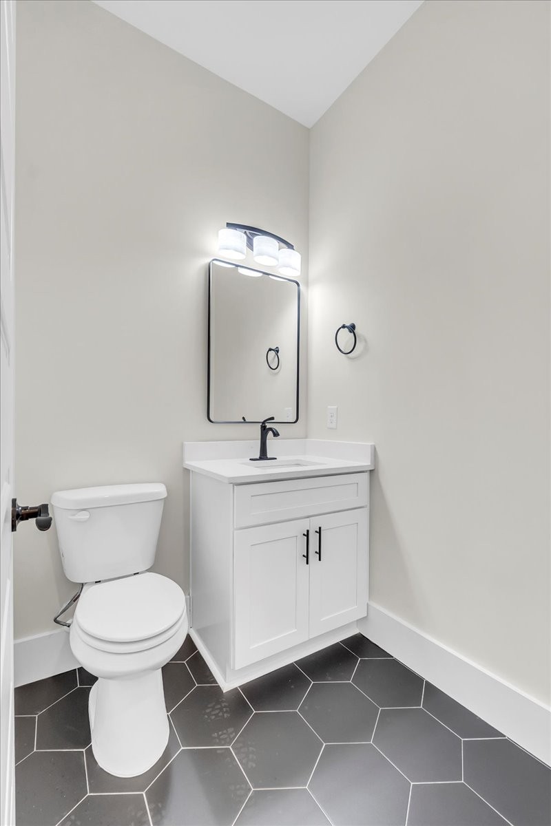 309 Hickory Grove Drive Morrison, TN 37357 - Photo 40 of 50 a bathroom with a toilet sink and mirror