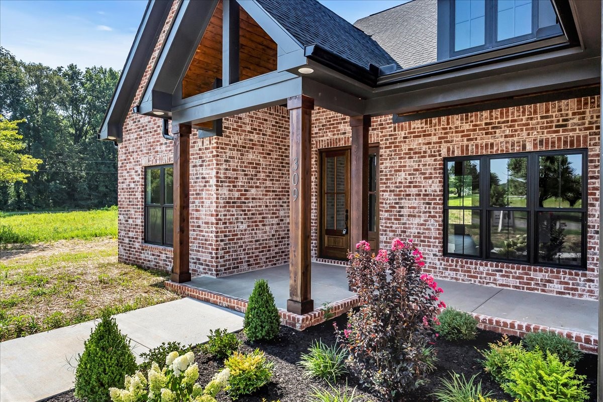 309 Hickory Grove Drive Morrison, TN 37357 - Photo 4 of 50 a view of a house with a garden