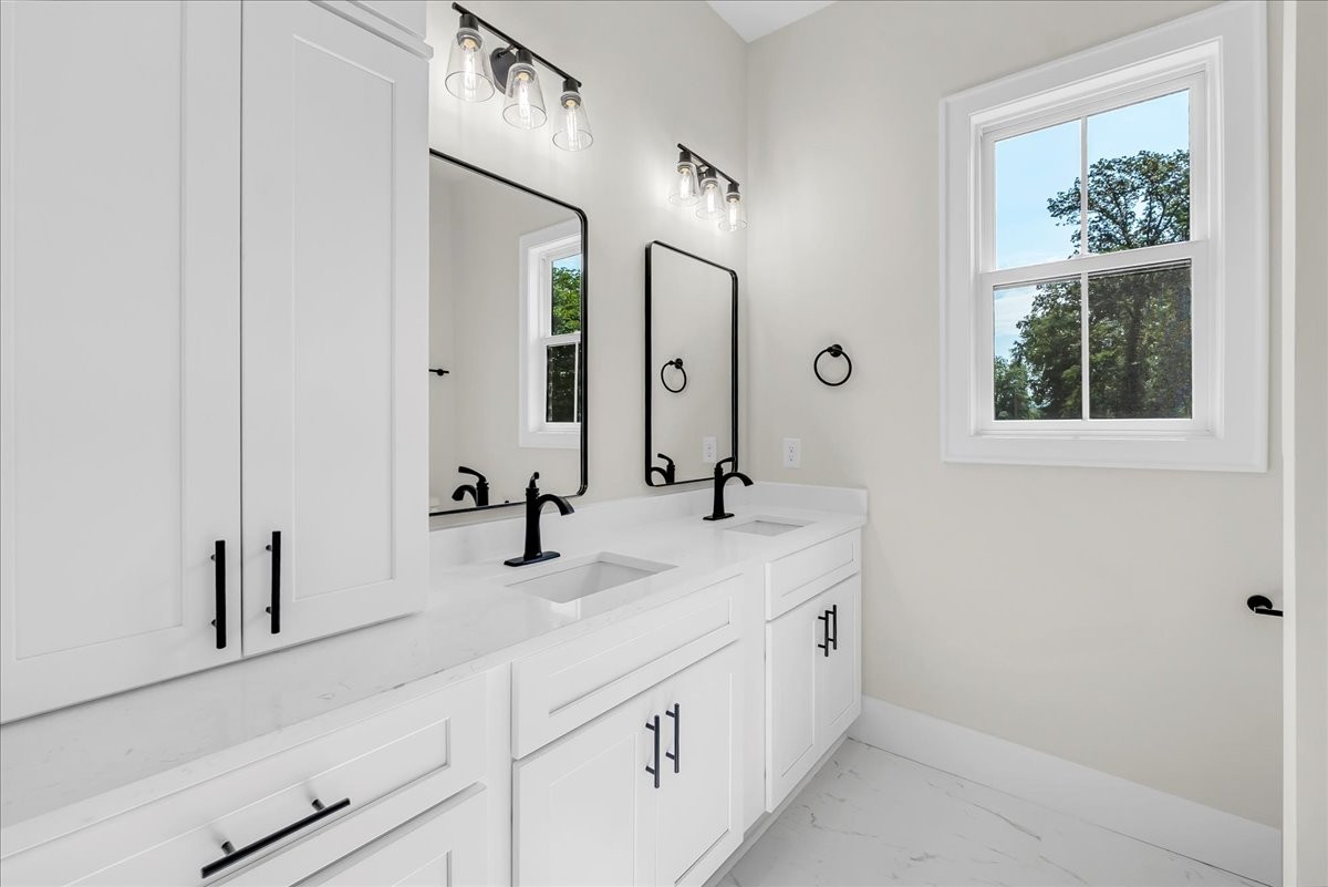 309 Hickory Grove Drive Morrison, TN 37357 - Photo 44 of 50 a bathroom with a double vanity sink and a mirror
