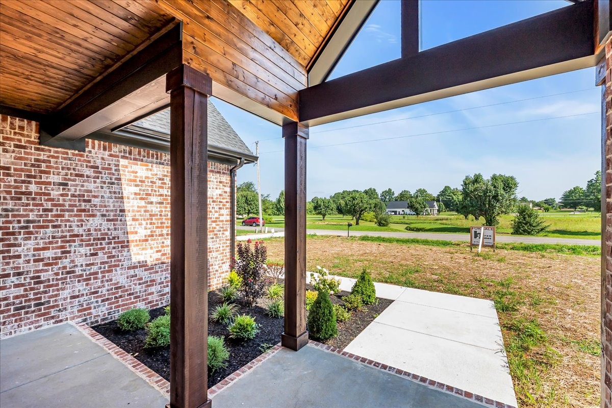 309 Hickory Grove Drive Morrison, TN 37357 - Photo 7 of 50 a view of a patio with a table and chairs next to a yard