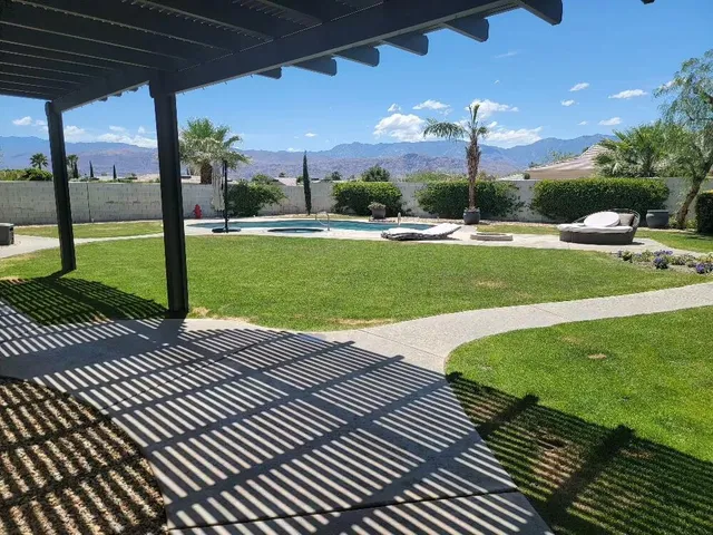 a view of a patio with a yard