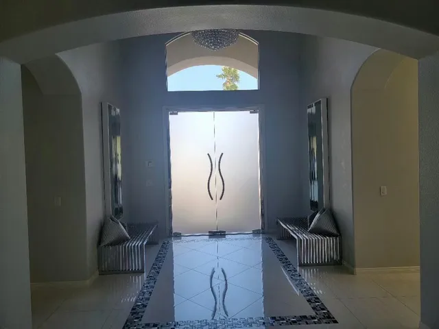 a view of a living room and entry way