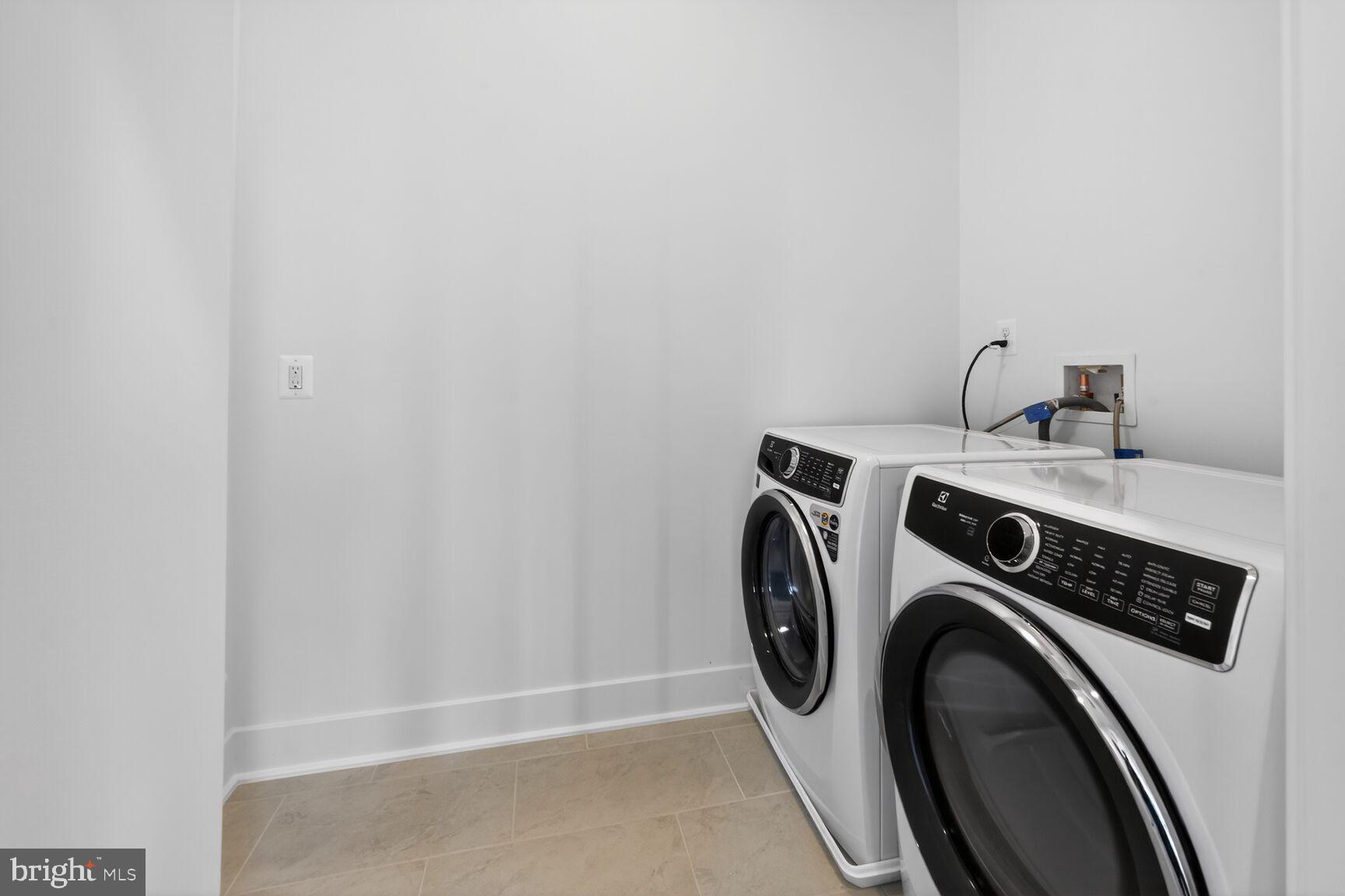 1135 Polaris Road, Unit NOTTINGHAM 101 Potomac, MD 20854 - Photo 19 of 26 a utility room with dryer and washer