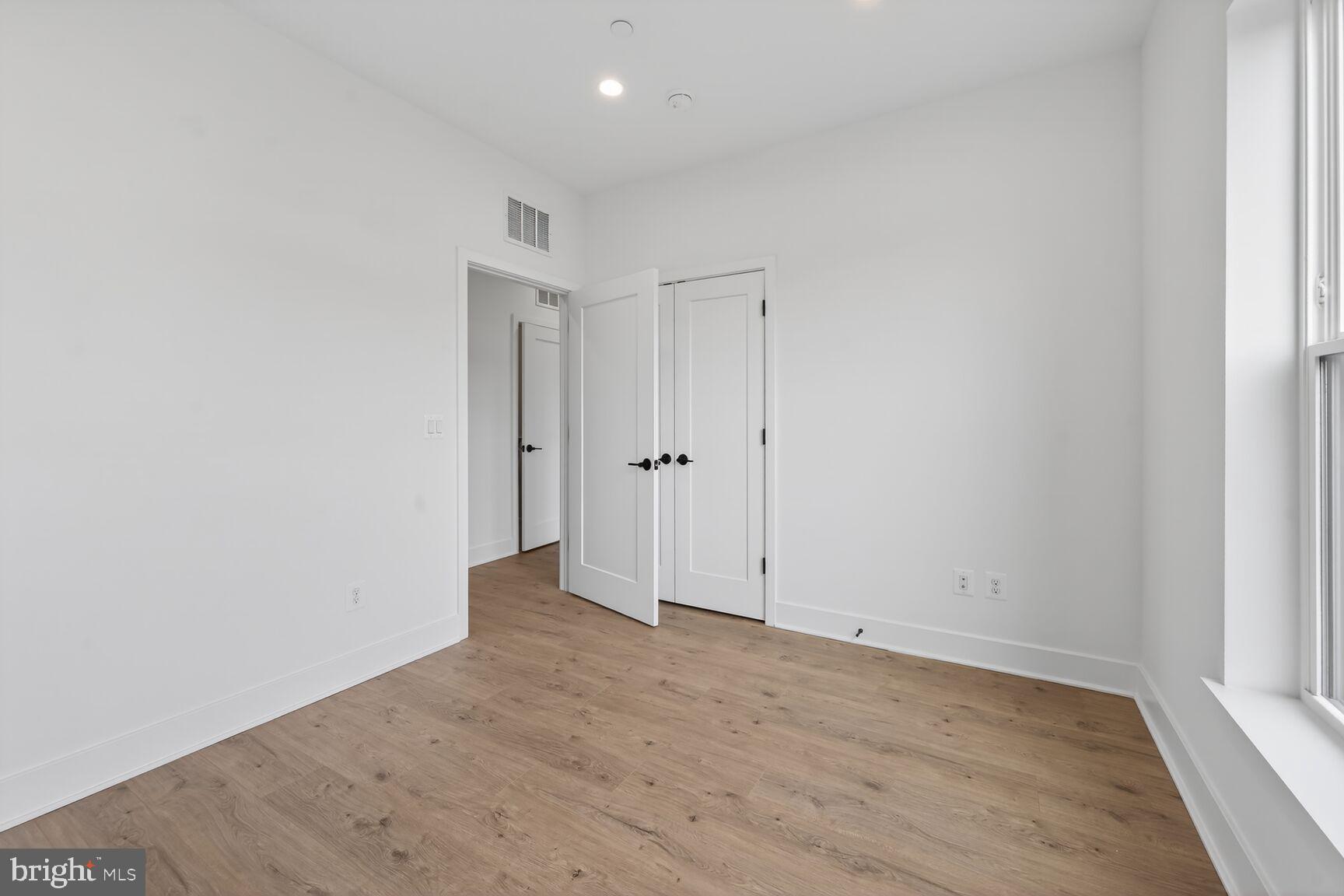 1135 Polaris Road, Unit NOTTINGHAM 101 Potomac, MD 20854 - Photo 20 of 26 wooden floor in an empty room