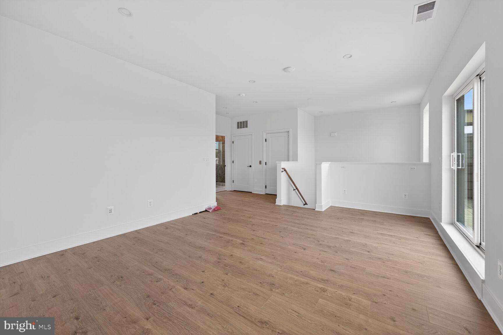 1135 Polaris Road, Unit NOTTINGHAM 101 Potomac, MD 20854 - Photo 22 of 26 a view of empty room with wooden floor