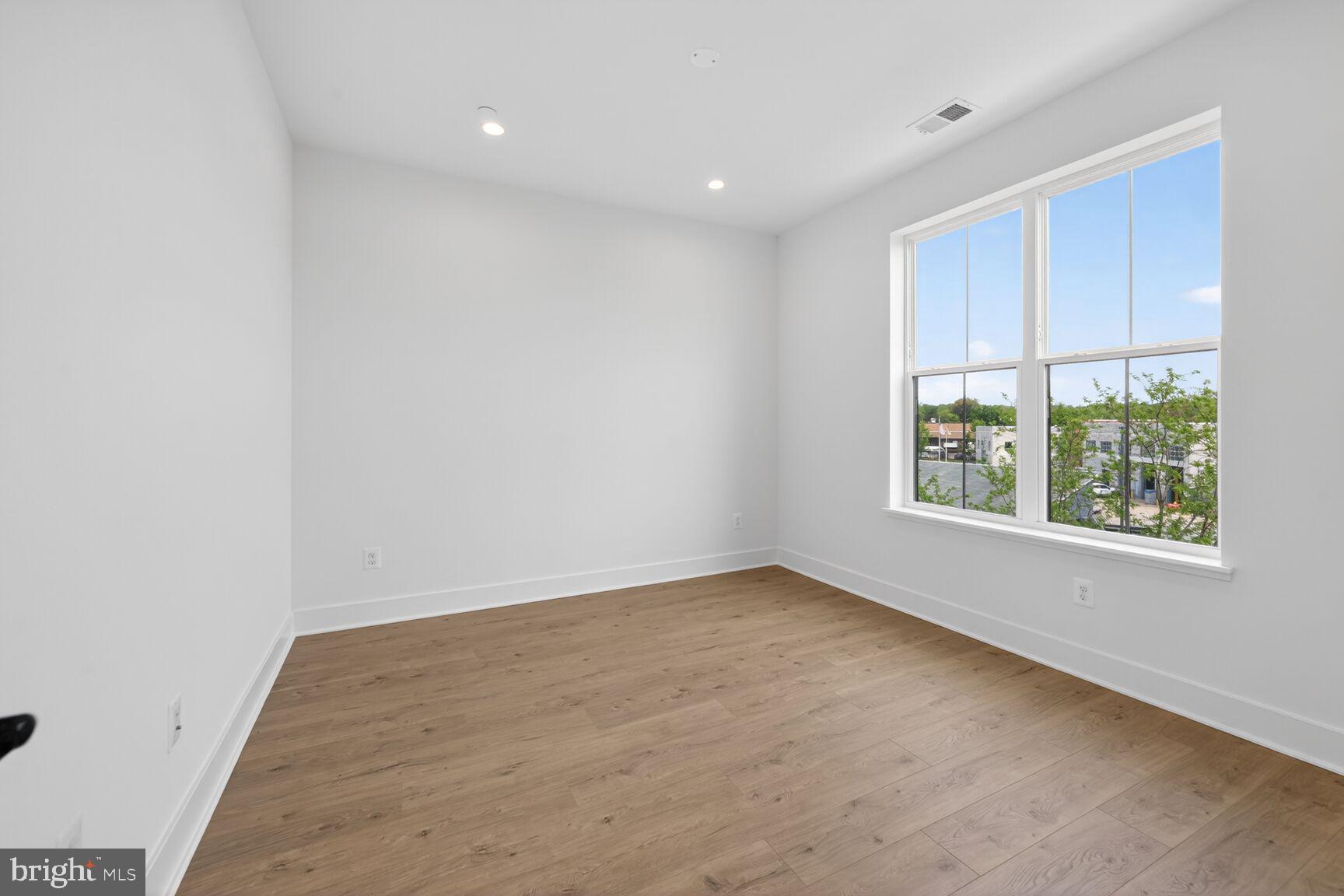 1135 Polaris Road, Unit NOTTINGHAM 101 Potomac, MD 20854 - Photo 24 of 26 an empty room with windows