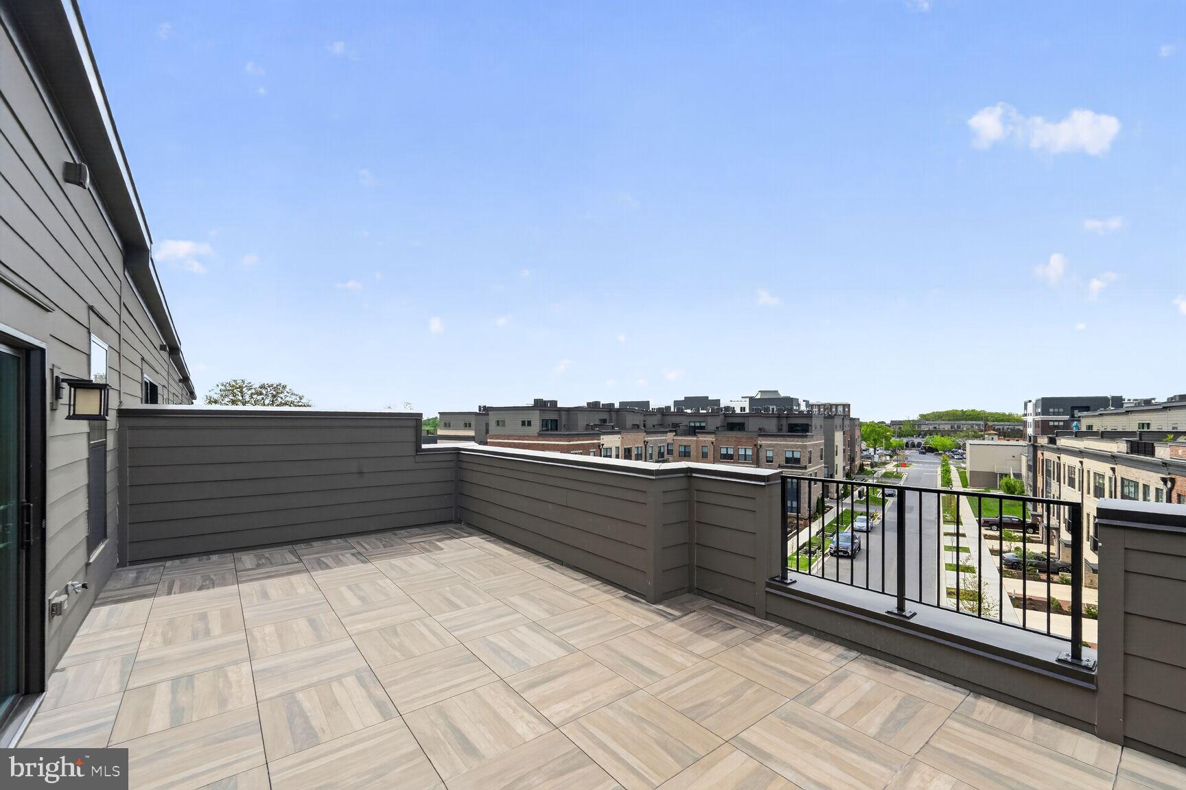1135 Polaris Road, Unit NOTTINGHAM 101 Potomac, MD 20854 - Photo 8 of 26 a view of a terrace with a bench