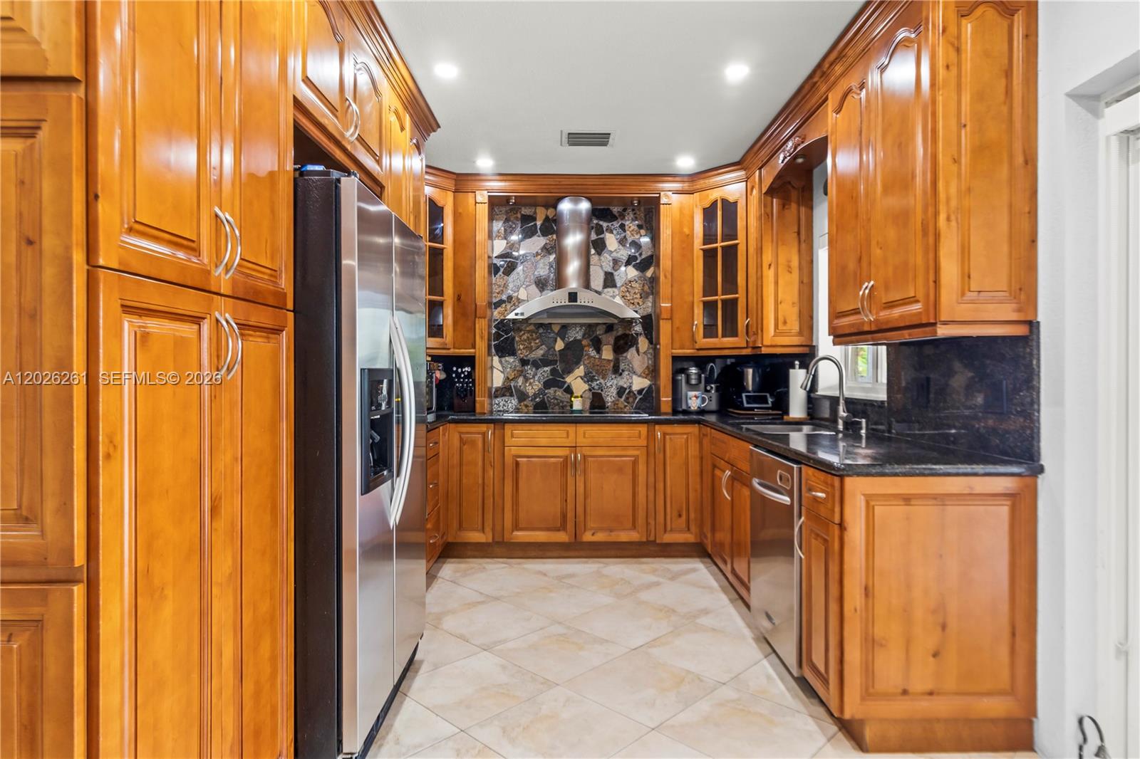 6250 Southwest 20th Terrace Miami, FL 33155 - Photo 6 of 42 a large kitchen with stainless steel appliances granite countertop a refrigerator and a sink