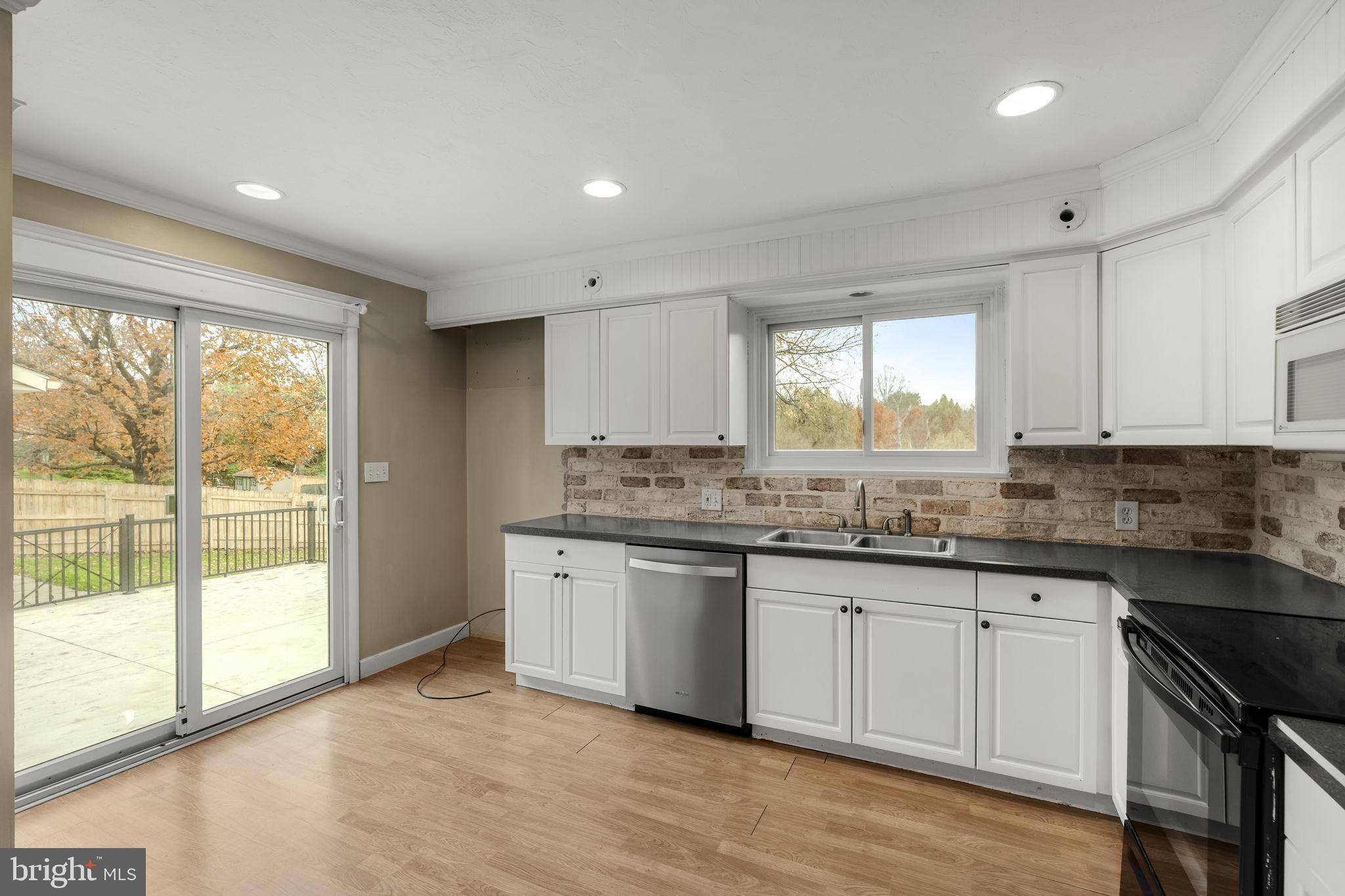 105 Hershey Road Lititz, PA 17543 - Photo 9 of 56 a kitchen with granite countertop a sink and a stove