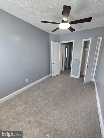 a view of a livingroom with a ceiling fan